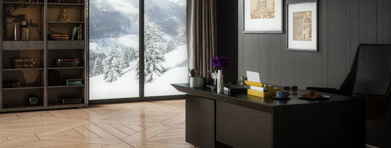 A dark wood office facing a tall window with a snowy mountain view